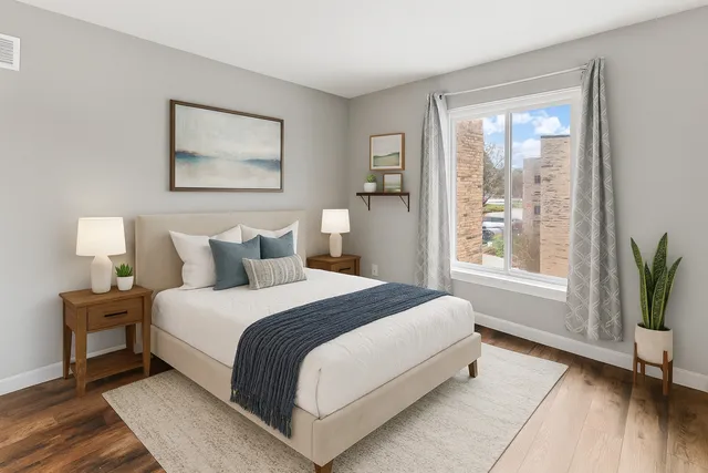 a bedroom with bed and a window