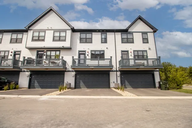 a front view of a house with a garage