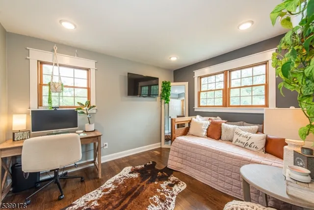 a bedroom with furniture and a window