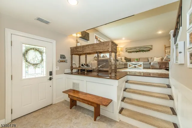 a view of a patio with couches and a table and chairs with garden view