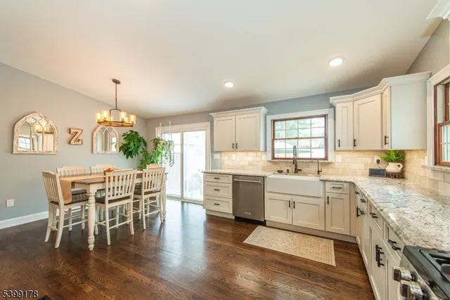 a large kitchen with a table and chairs