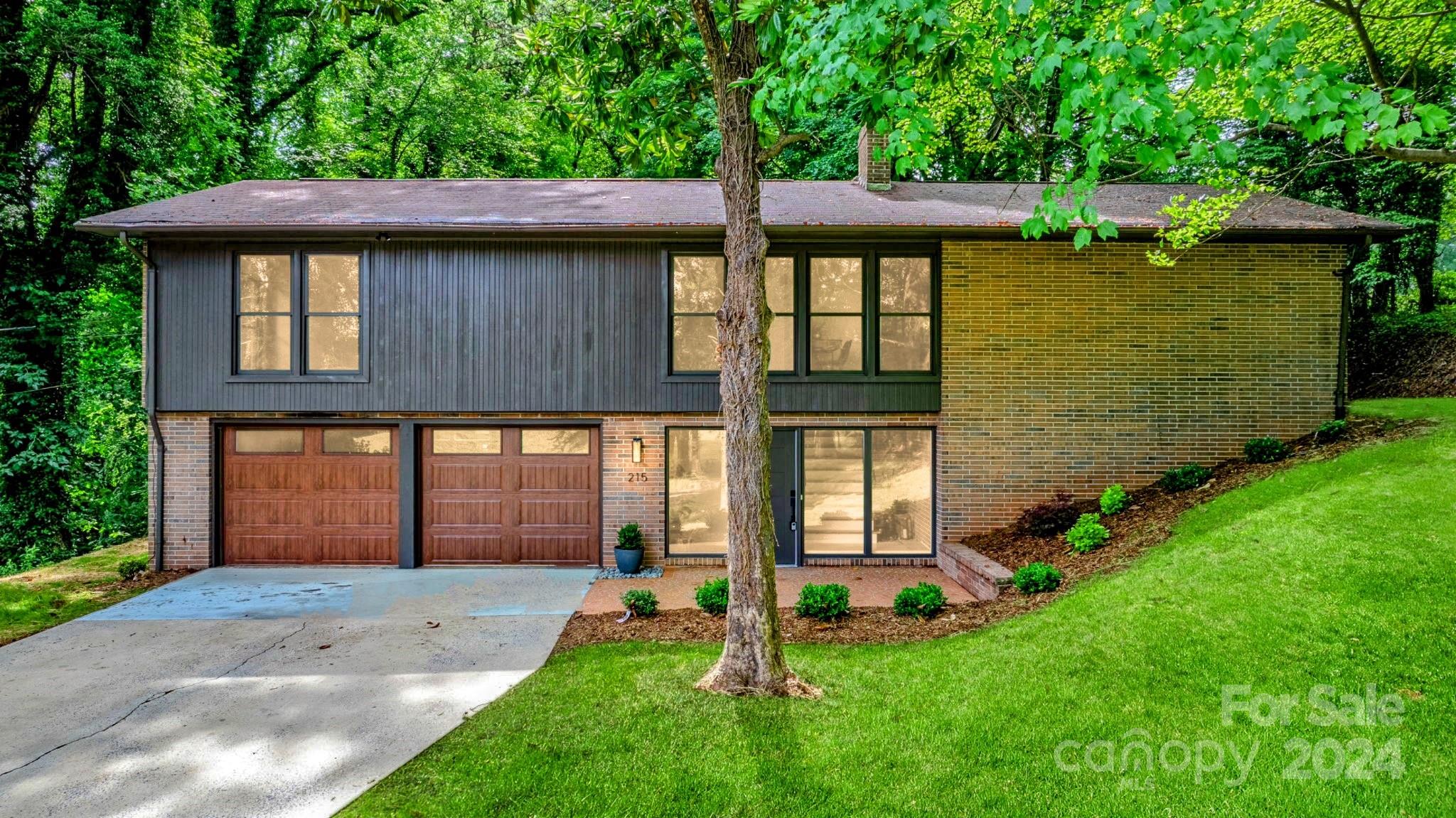 front view of a house with a yard