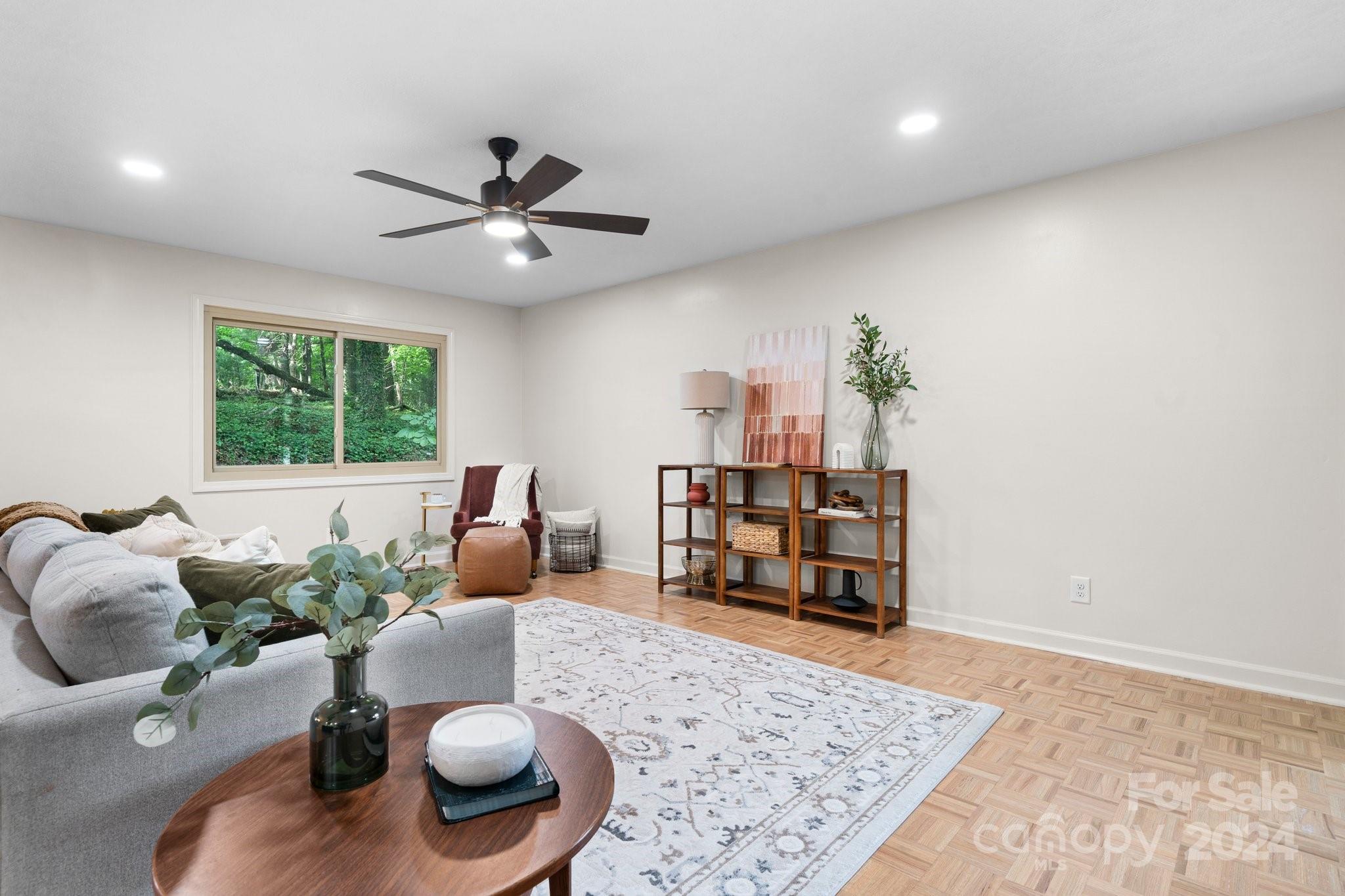 215 Blanton Road Morganton, NC 28655 - Photo 13 of 40 a living room with furniture and a rug