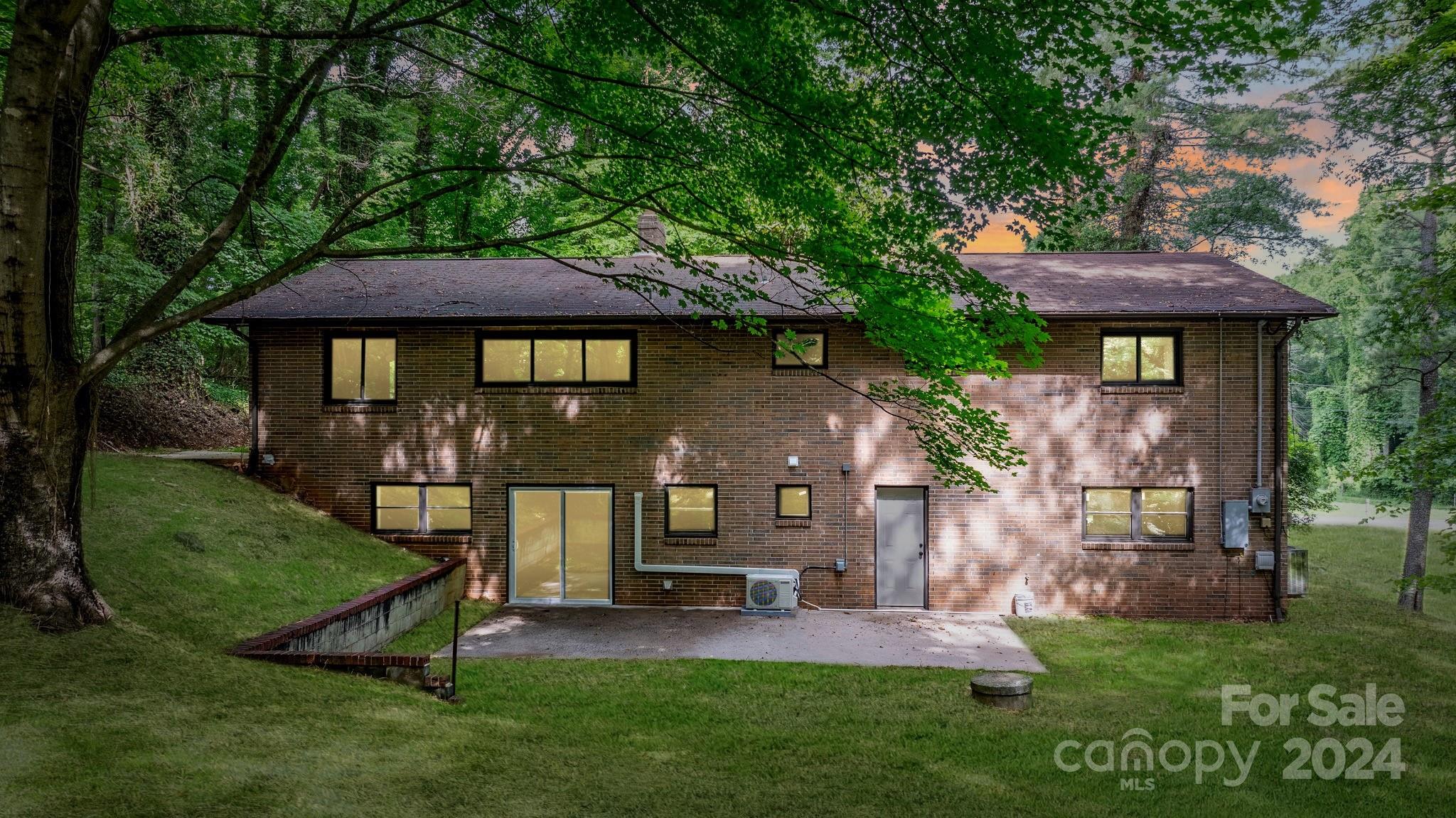 215 Blanton Road Morganton, NC 28655 - Photo 2 of 40 a front view of a house with a garden