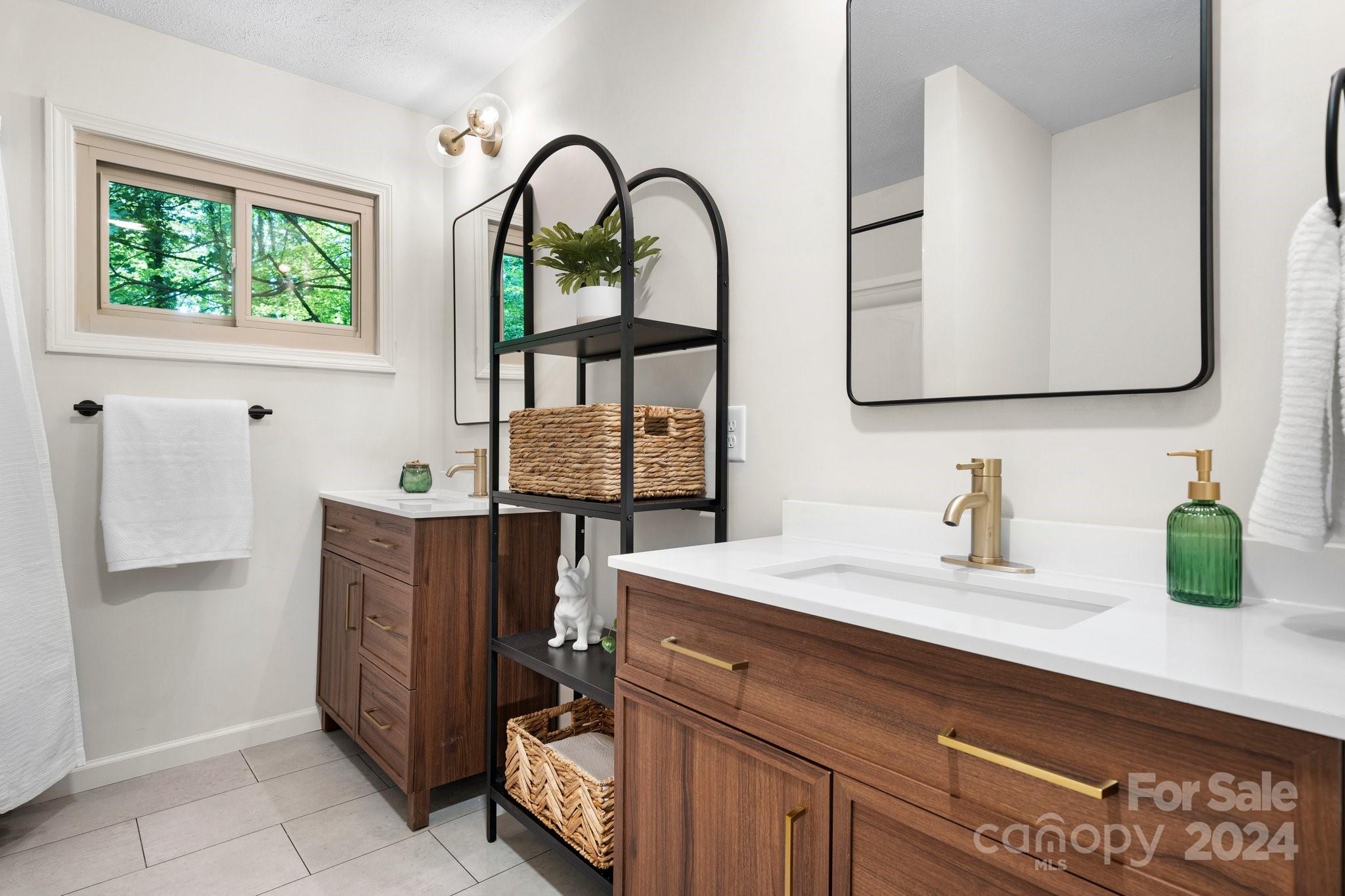 215 Blanton Road Morganton, NC 28655 - Photo 21 of 40 a bathroom with a sink and a mirror