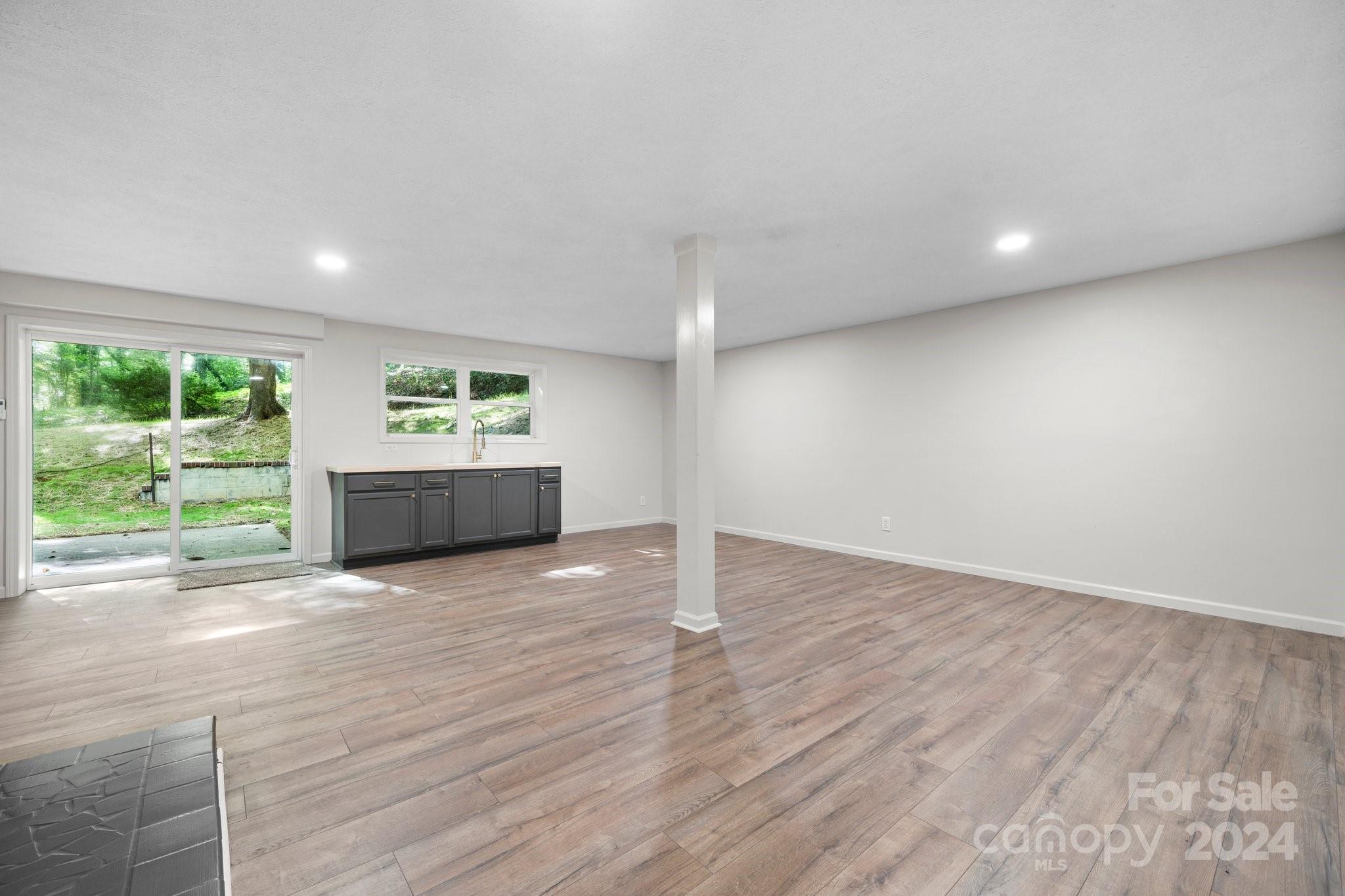 215 Blanton Road Morganton, NC 28655 - Photo 24 of 40 a view of empty room with wooden floor and fan