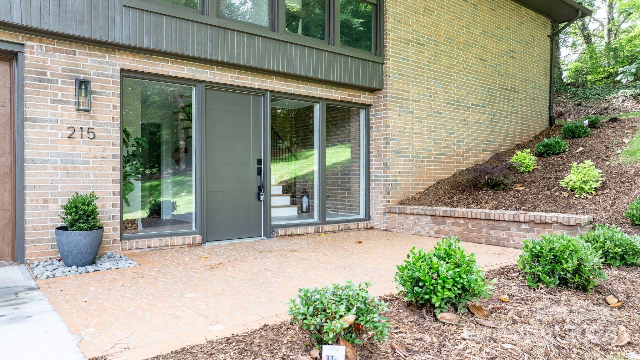215 Blanton Road Morganton, NC 28655 - Photo 3 of 40 a front view of a house with a garden