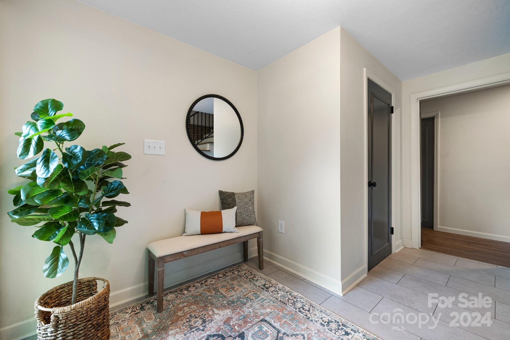215 Blanton Road Morganton, NC 28655 - Photo 5 of 40 a living room with furniture and a potted plant