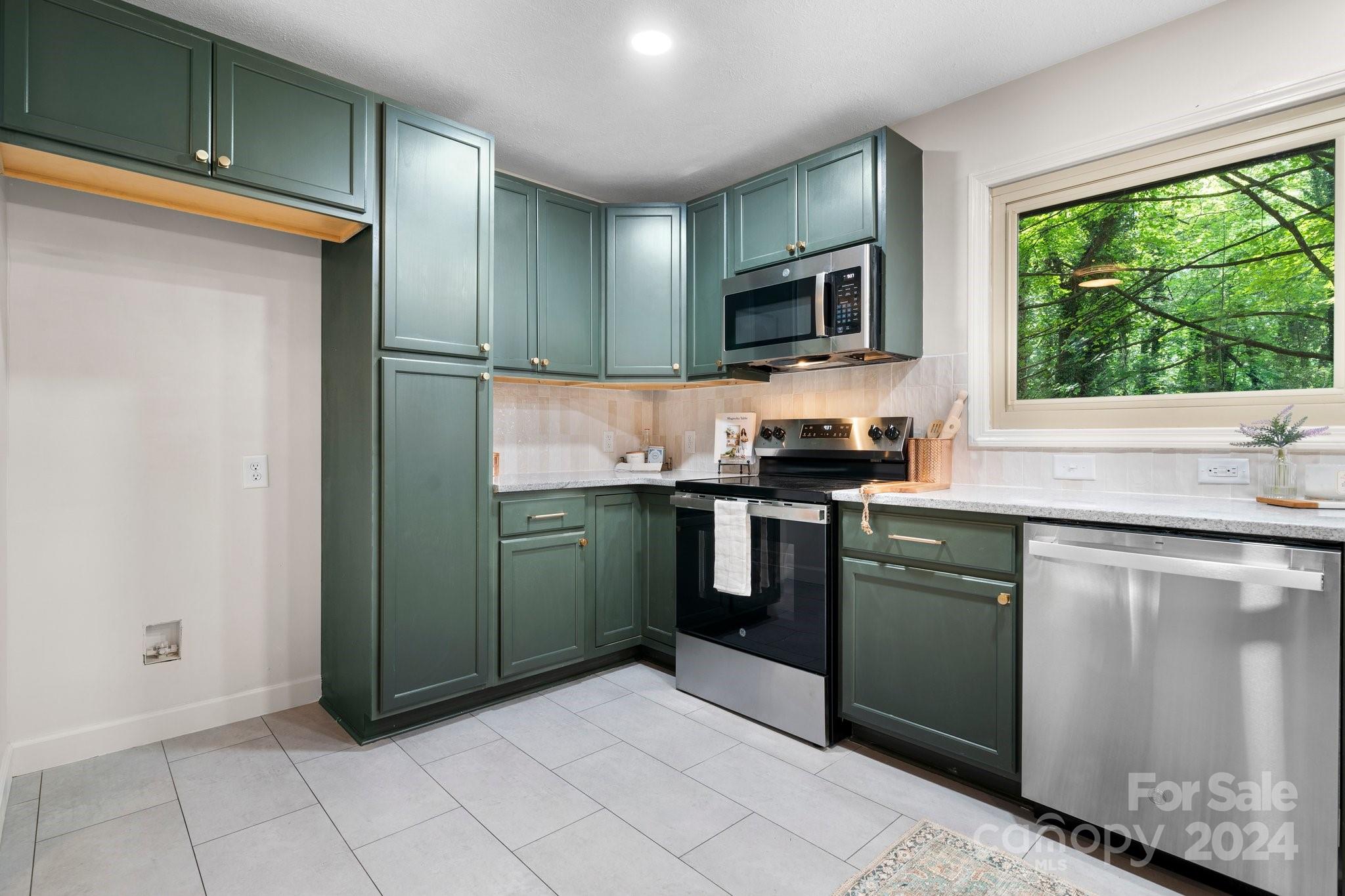 215 Blanton Road Morganton, NC 28655 - Photo 9 of 40 a kitchen with stainless steel appliances granite countertop a refrigerator and a sink