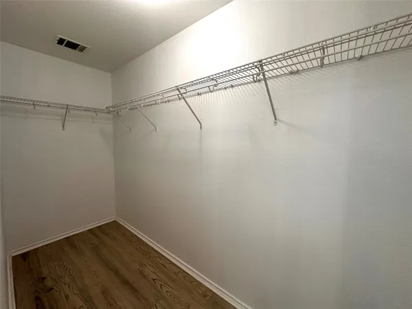 a view of a room with racks on the wall