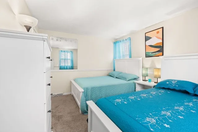 a bedroom with a bed and a cabinets