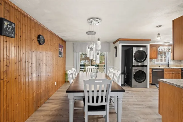a view of a livingroom with furniture washer and dryer