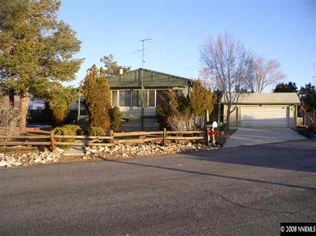 225 Aries Circle Reno, NV 89521 - Photo 1 of 9 a front view of a house with a yard