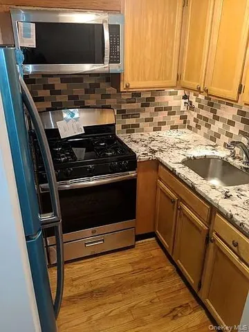 a kitchen with a stove and a microwave