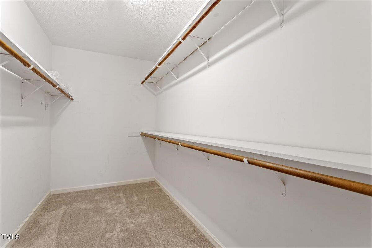 69 Forest Oaks Drive Durham, NC 27705 - Photo 17 of 31 a view of closet with wooden floor