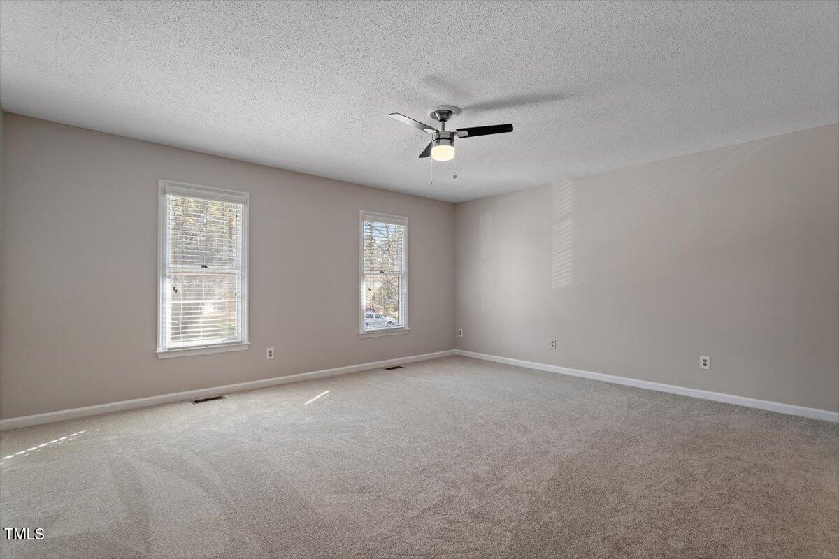69 Forest Oaks Drive Durham, NC 27705 - Photo 19 of 31 a view of empty room with windows