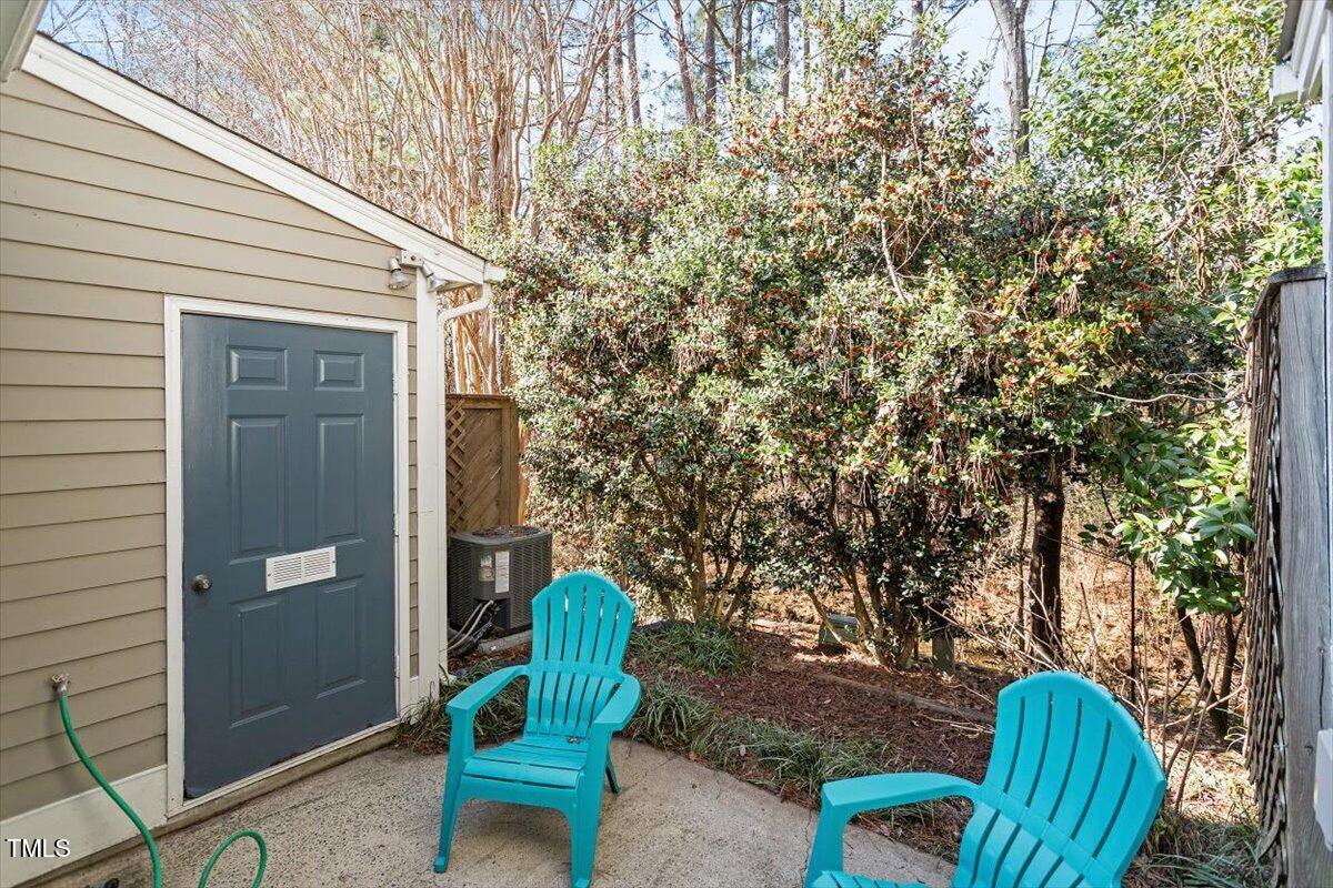 69 Forest Oaks Drive Durham, NC 27705 - Photo 26 of 31 a view of a chair in backyard of the house