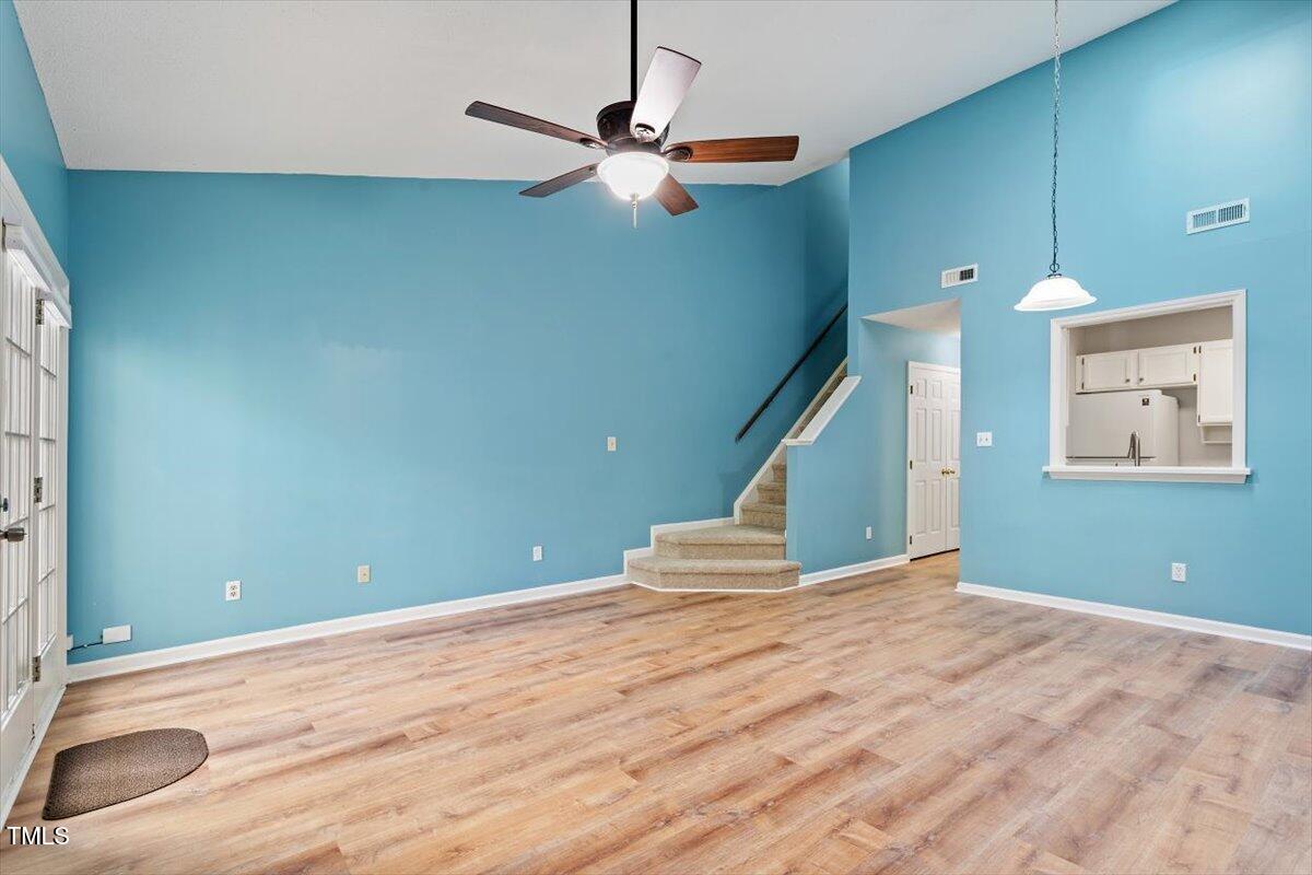69 Forest Oaks Drive Durham, NC 27705 - Photo 7 of 31 a view of a room with wooden floor and white walls