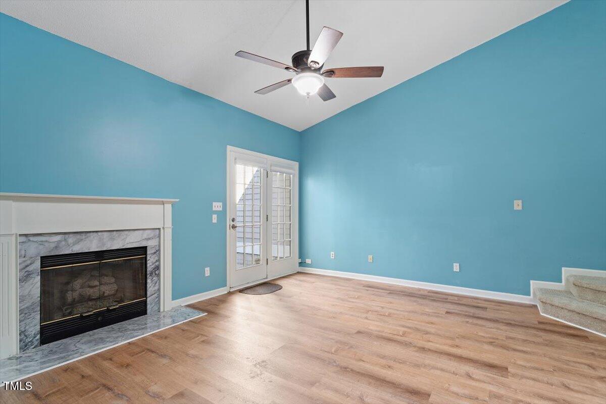 69 Forest Oaks Drive Durham, NC 27705 - Photo 8 of 31 a view of empty room with fan and fireplace