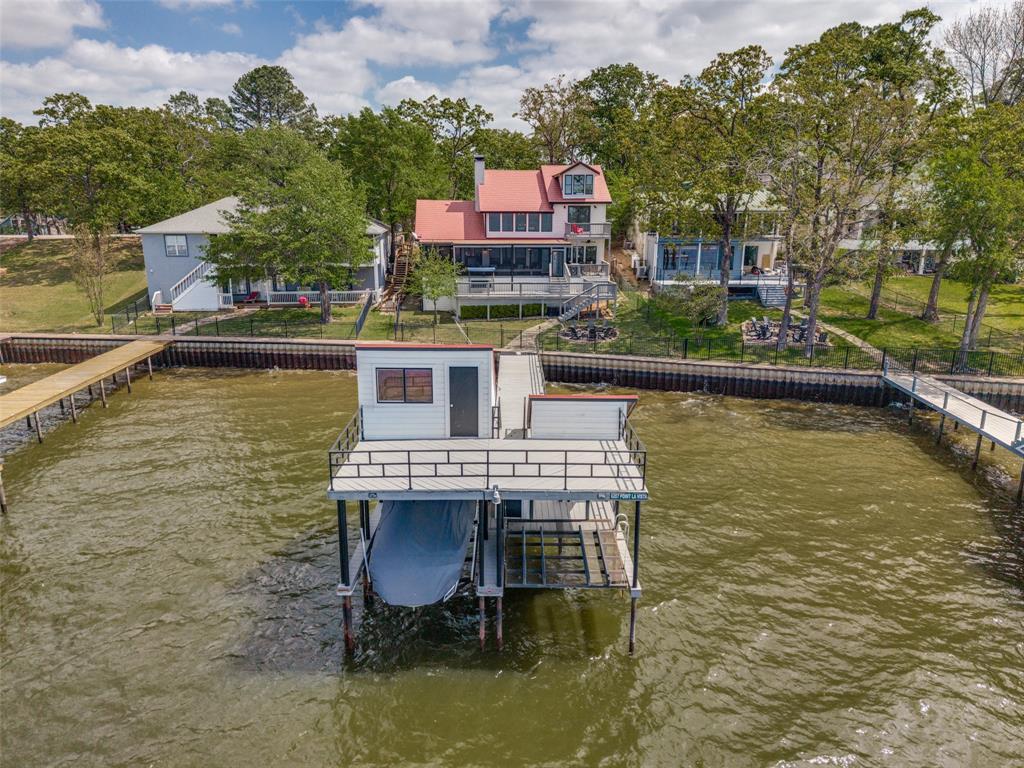 a balcony with table and chairs
