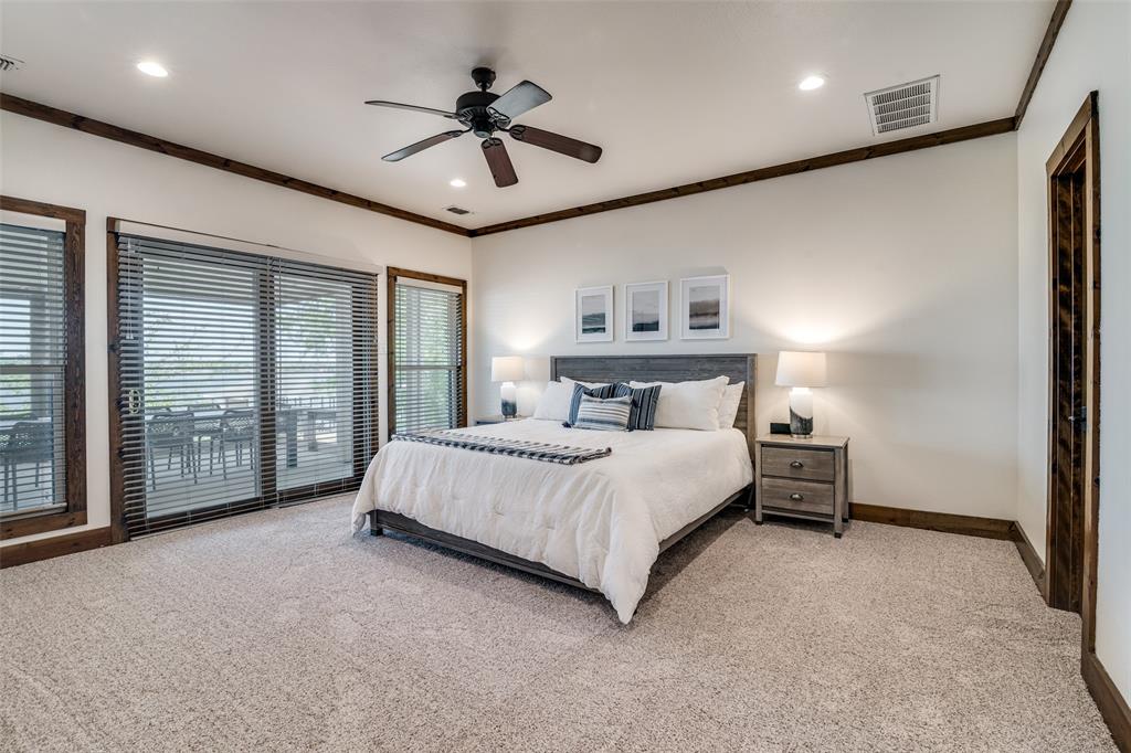 6207 Point Lavista Malakoff, TX 75148 - Photo 13 of 40 a spacious bedroom with a large bed and a large window
