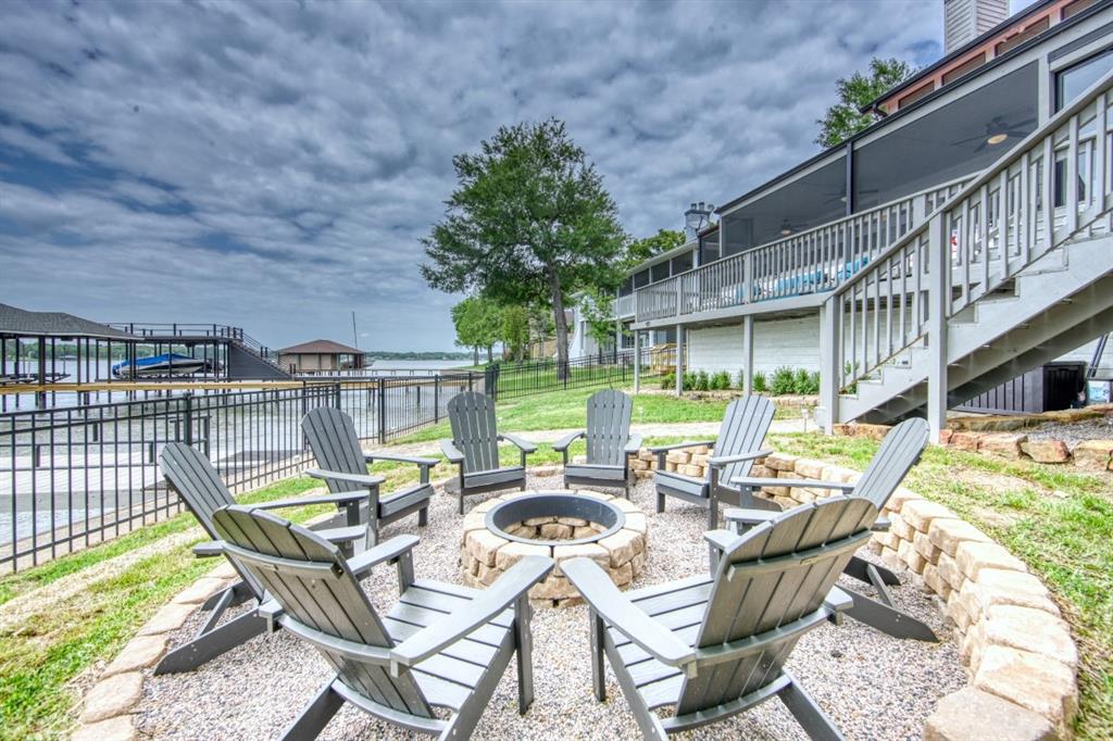 6207 Point Lavista Malakoff, TX 75148 - Photo 38 of 40 a view of a patio with table and chairs potted plants with wooden floor and fence