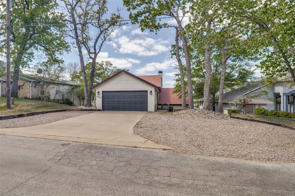 6207 Point Lavista Malakoff, TX 75148 - Photo 40 of 40 a front view of a house with a yard and garage