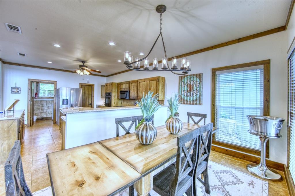 6207 Point Lavista Malakoff, TX 75148 - Photo 9 of 40 a view of a dining room with furniture and wooden floor