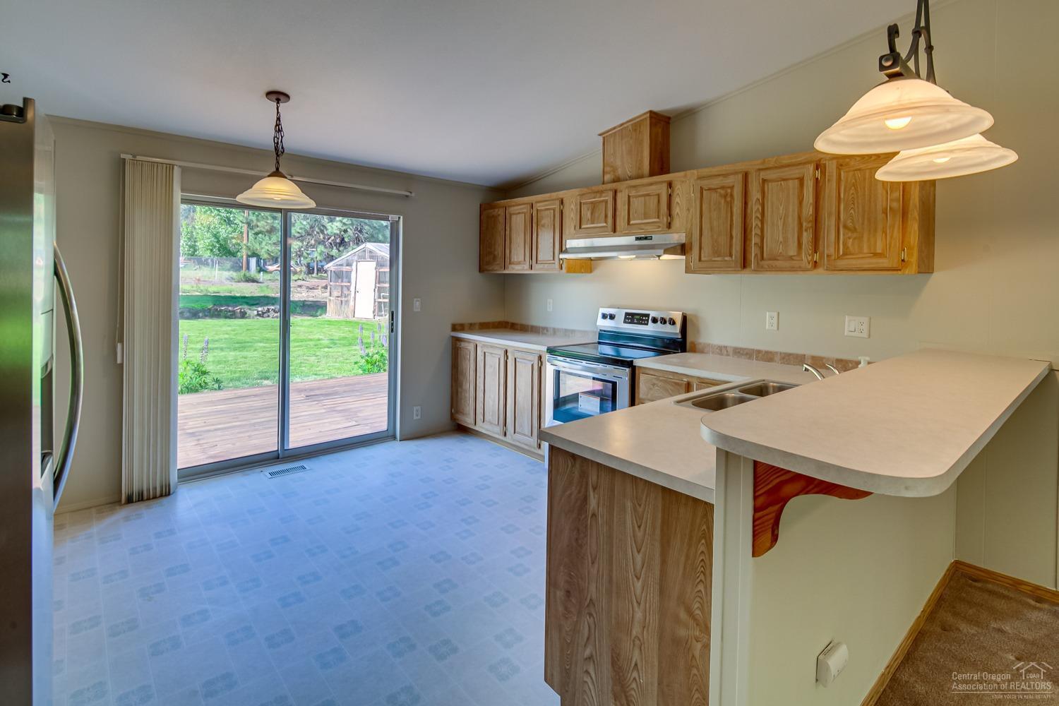 19325 Baker Road Bend, OR 97702 - Photo 7 of 25 Open kitchen/dining area, new stainless