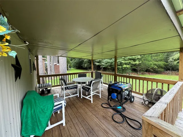 a view of balcony with couch and wooden floor