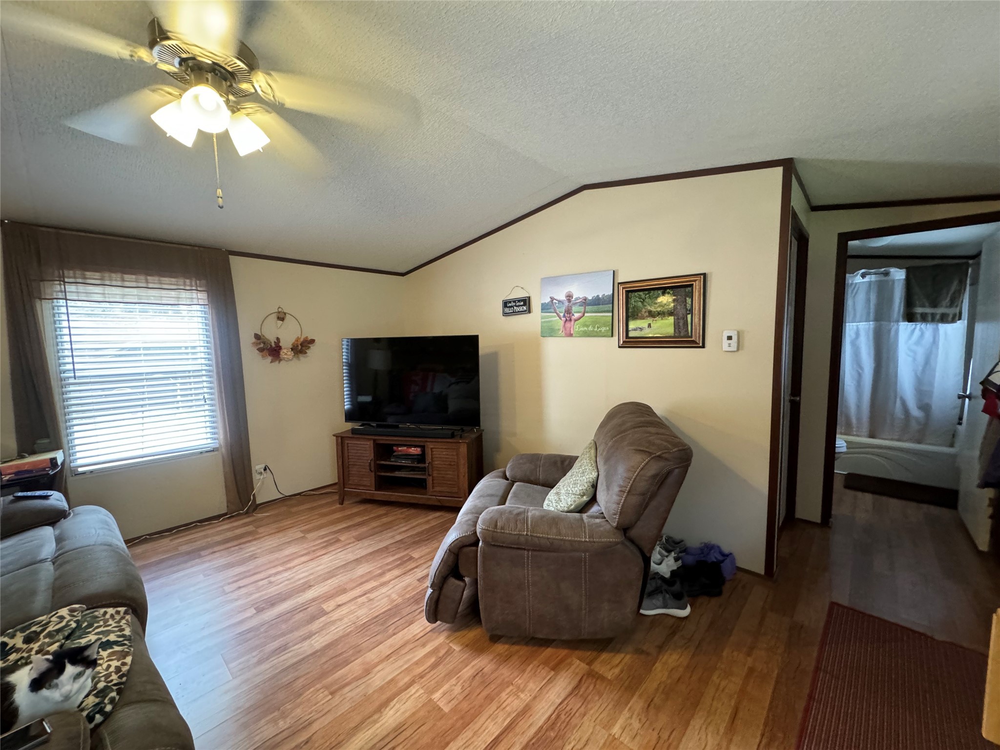 18 Mockingbird Trinity, TX 75862 - Photo 24 of 30 a living room with furniture and a flat screen tv
