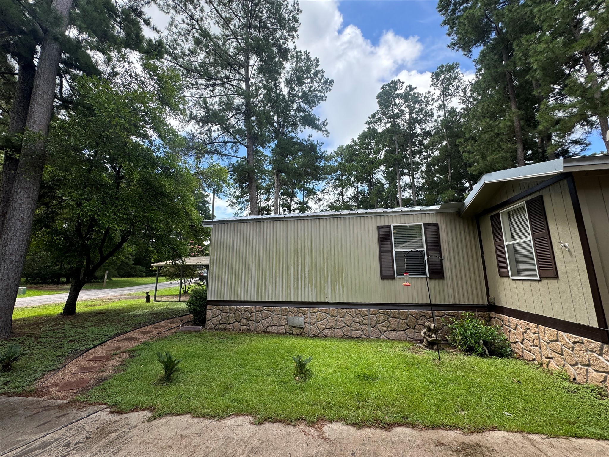 18 Mockingbird Trinity, TX 75862 - Photo 6 of 30 a view of backyard with large tree and wooden fence