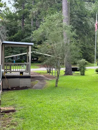 a view of a backyard with a garden and plants