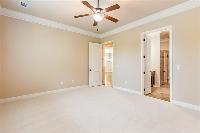 424 Loblolly Street Woodstock, GA 30188 - Photo 19 of 57 a view of an empty room and a ceiling fan