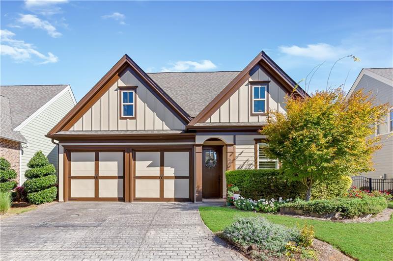 424 Loblolly Street Woodstock, GA 30188 - Photo 2 of 57 a front view of a house with a yard and potted plants