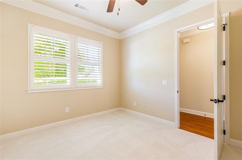 424 Loblolly Street Woodstock, GA 30188 - Photo 25 of 57 a view of an empty room with a window