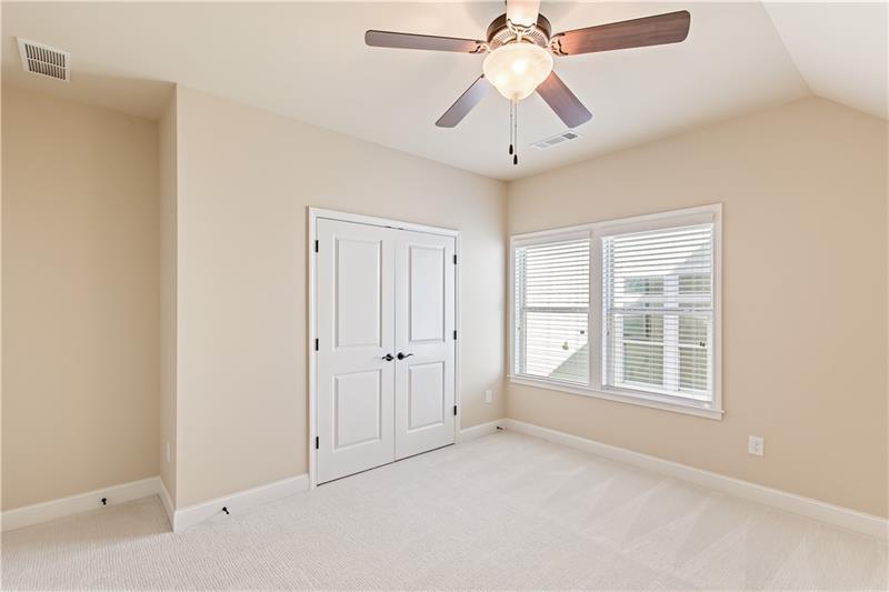 424 Loblolly Street Woodstock, GA 30188 - Photo 33 of 57 an empty room with windows and fan