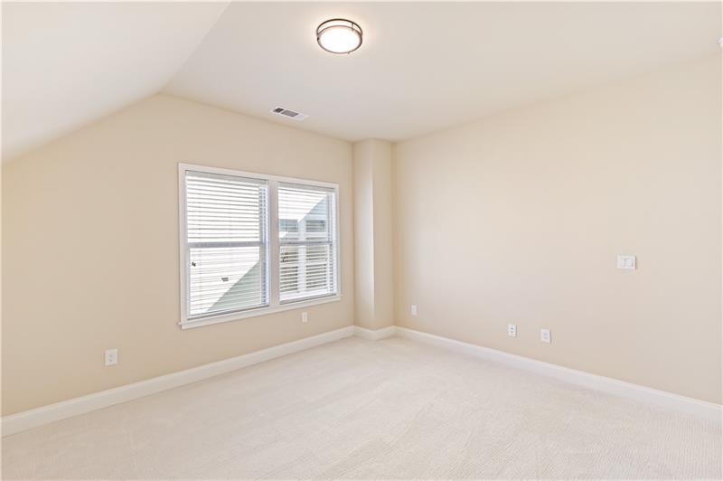 424 Loblolly Street Woodstock, GA 30188 - Photo 37 of 57 an empty room with a window