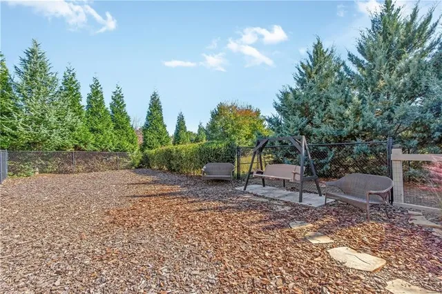 an aerial view of a house with outdoor space