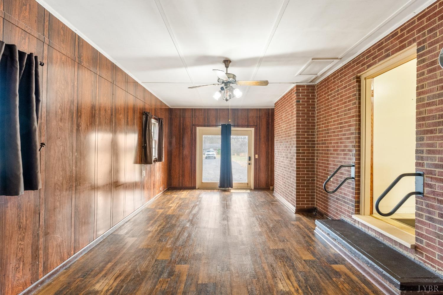 528 Jasper Wood Road Hurt, VA 24563 - Photo 15 of 44 a view of gallery with window and wooden floor
