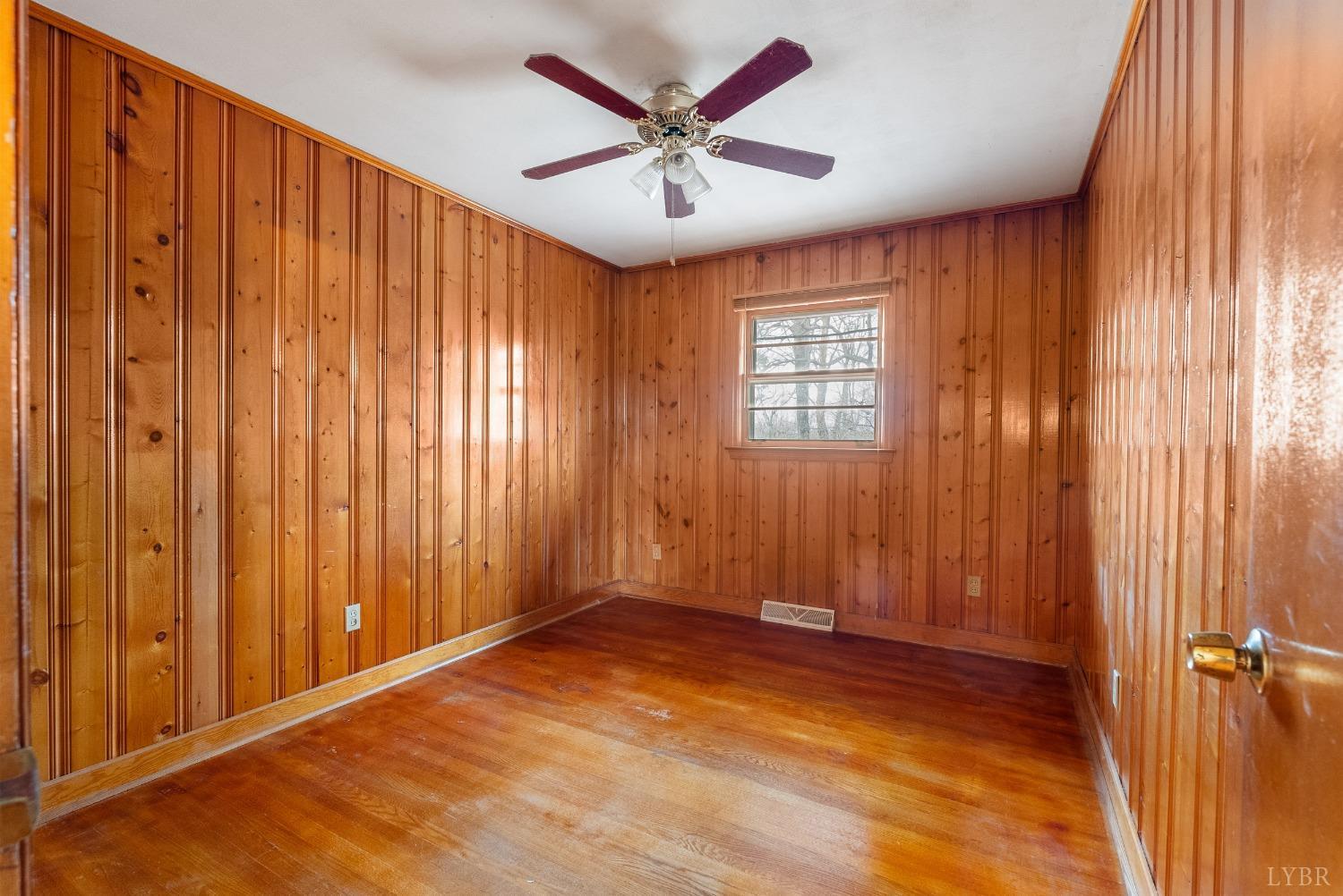 528 Jasper Wood Road Hurt, VA 24563 - Photo 17 of 44 wooden floor in an empty room with a window