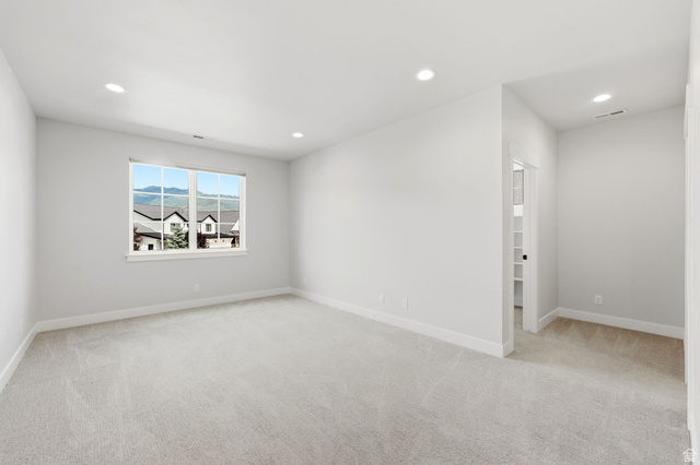 496 North Farmhouse Way, Unit 11 Midway, UT 84049 - Photo 33 of 50 Spacious interior room with light neutral carpet and white trim
