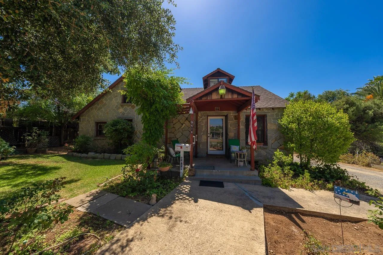 9414 Winter Gardens Boulevard Lakeside, CA 92040 - Photo 3 of 20 a front view of a house with garden