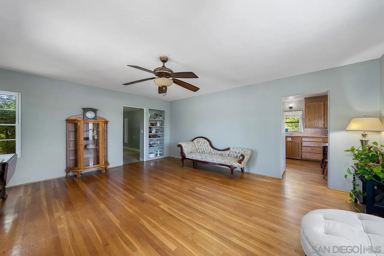 9414 Winter Gardens Boulevard Lakeside, CA 92040 - Photo 8 of 20 a living room with furniture and wooden floor