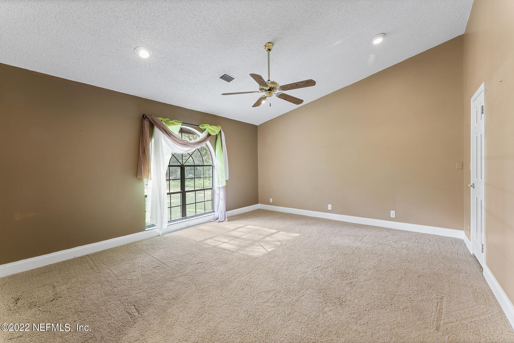 6130 Firestone Road Jacksonville, FL 32244 - Photo 33 of 67 a view of an empty room with a window