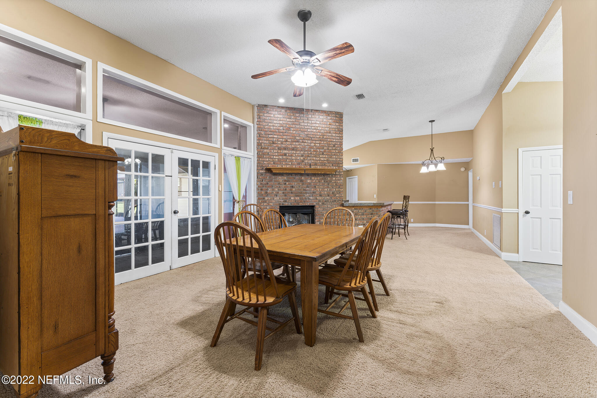 6130 Firestone Road Jacksonville, FL 32244 - Photo 34 of 67 a view of a dining room with furniture window and wooden floor