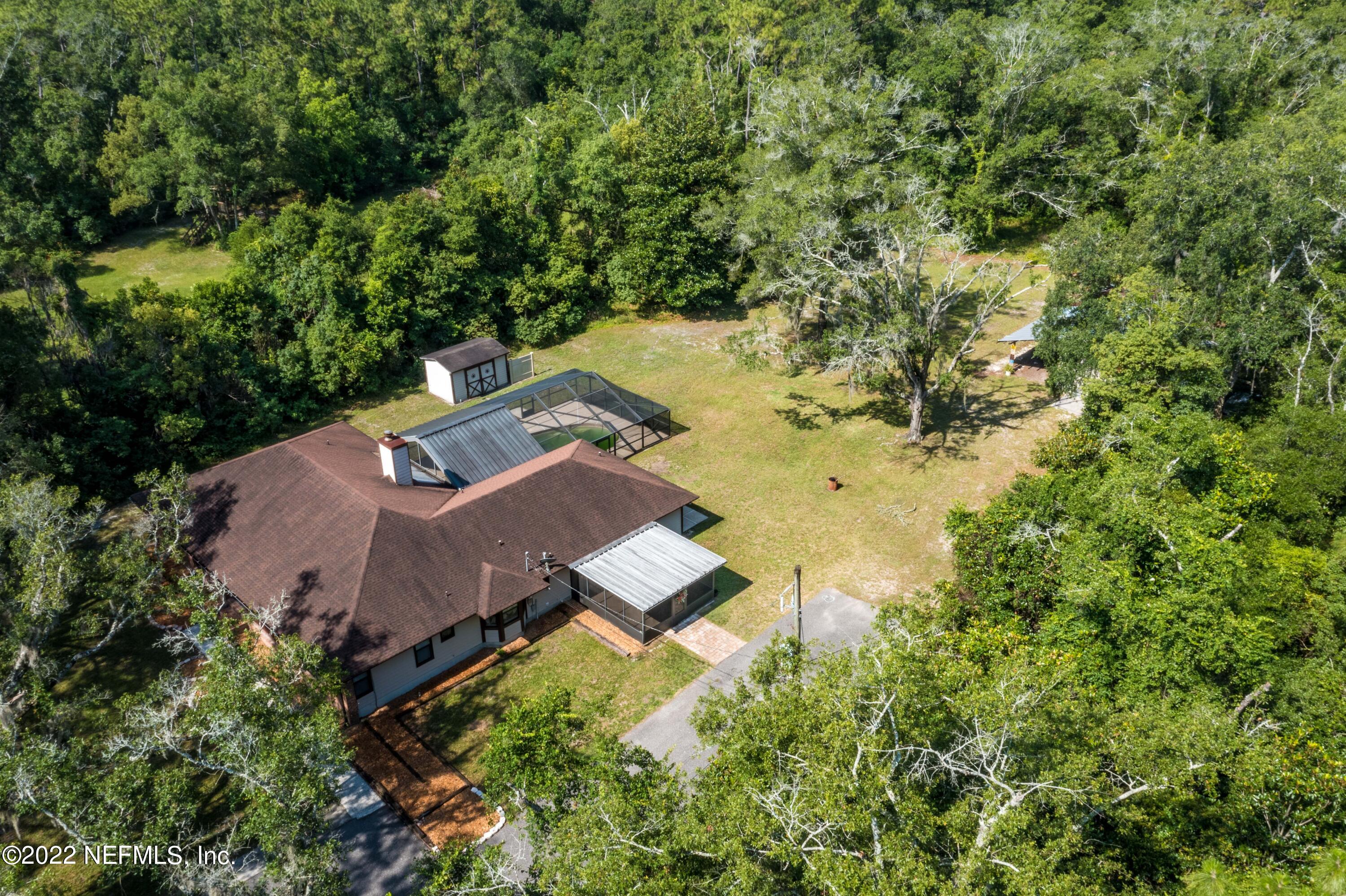 6130 Firestone Road Jacksonville, FL 32244 - Photo 35 of 67 an aerial view of a house with a yard