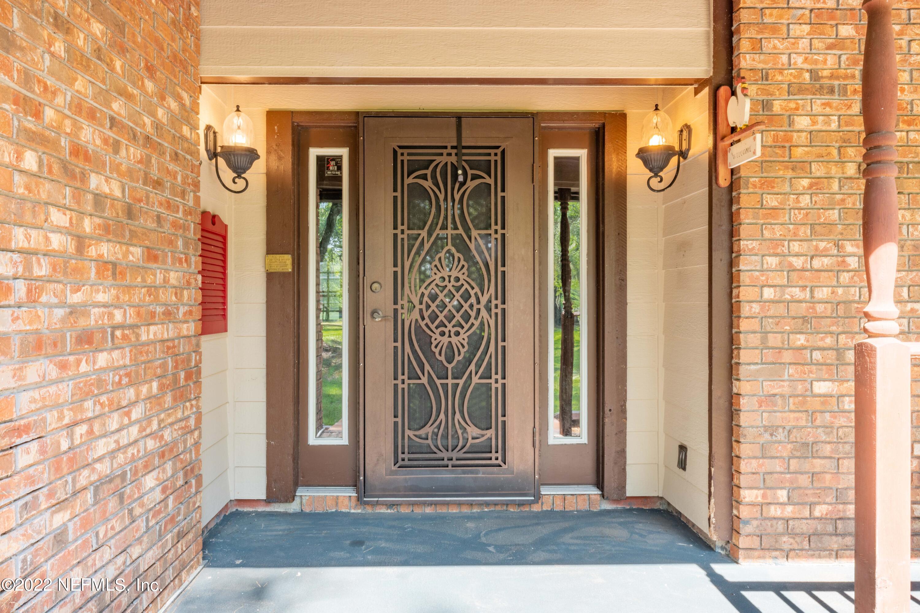 6130 Firestone Road Jacksonville, FL 32244 - Photo 4 of 67 a view of entrance door of the house