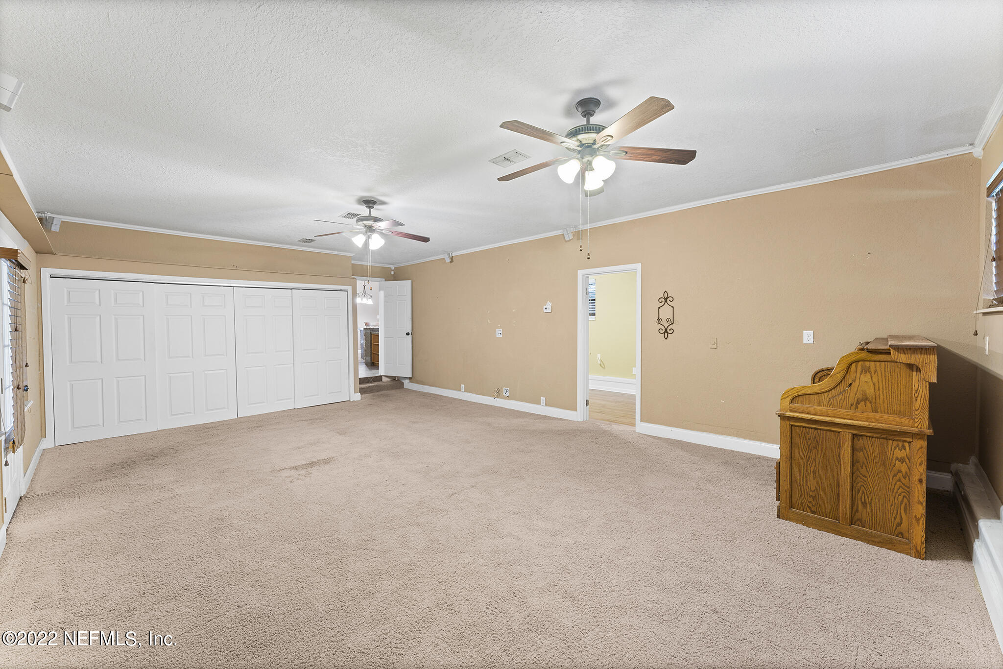 6130 Firestone Road Jacksonville, FL 32244 - Photo 46 of 67 a view of a livingroom with a chandelier fan