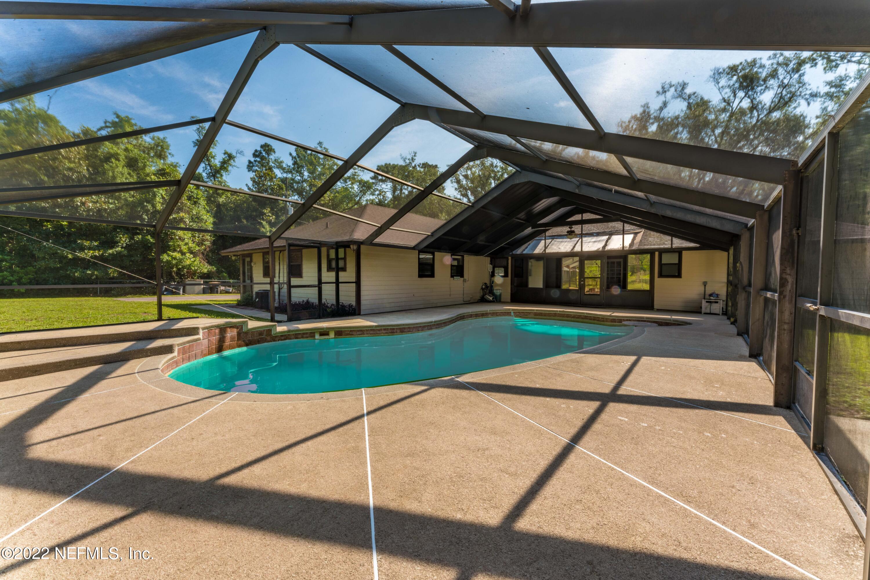 6130 Firestone Road Jacksonville, FL 32244 - Photo 50 of 67 screened pool with coverd patio